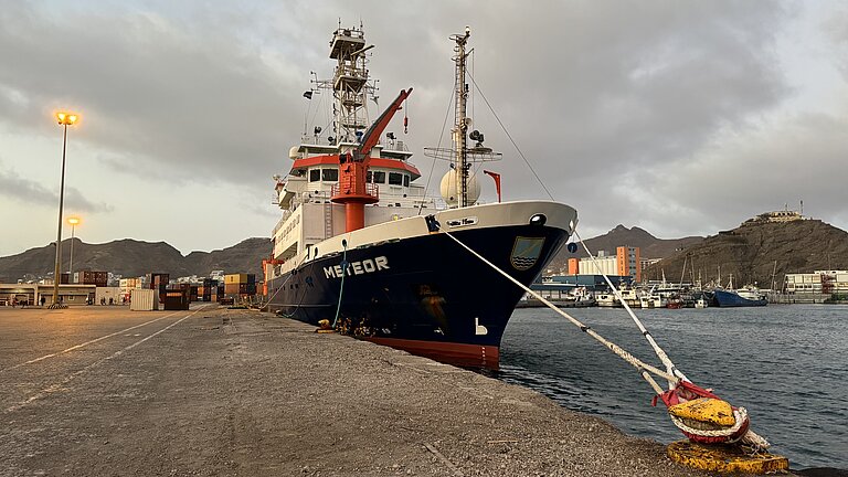 A ship is moored in the harbour